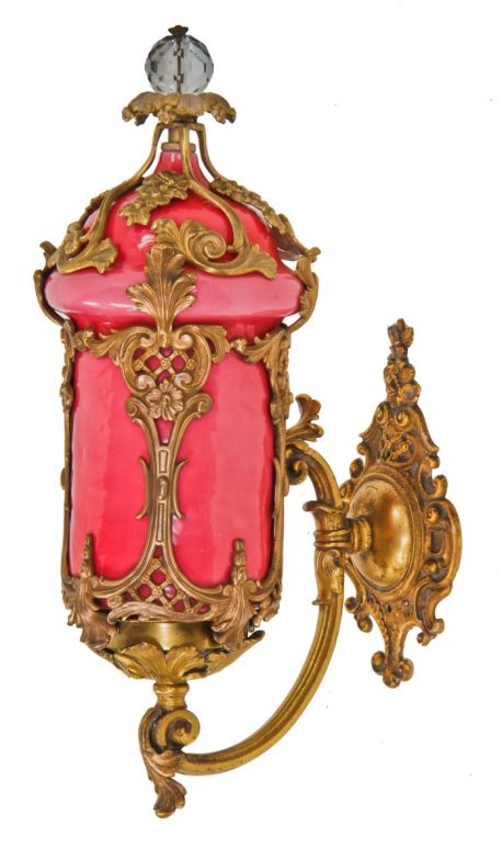 set of two identical and all original c. 1920's american rococo style art glass interior wall-mount uptown theater illuminated cast bronze sconces with largely intact gilded finish 