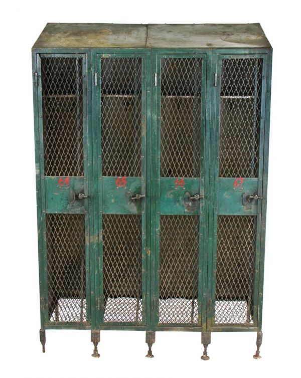 rare and highly sought after early 20th century largely intact "expanded metal type" green painted federal freestanding locker unit with hand-painted red numbers