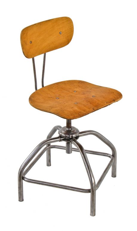 original and fully functional refinished adjustable height c. 1950's american industrial four-legged tubular steel stool with intact backrest and saddle seat