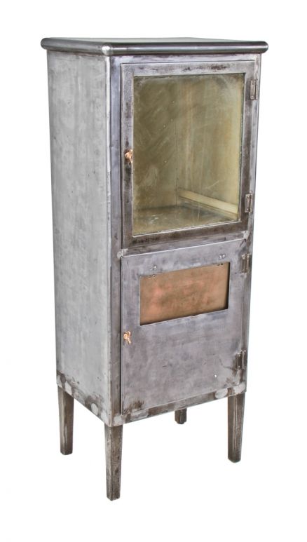 c. early 1920's refinished american antique medical freestanding hinged door steel medical cabinet with distinctive pivoting trash chute and intact bronze handles