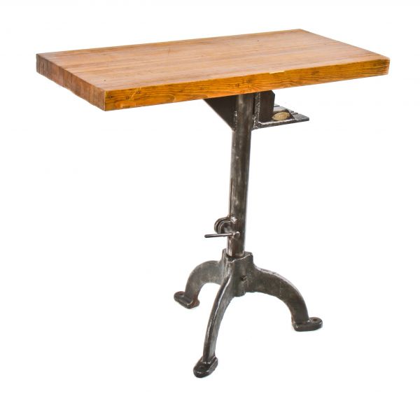 refinished c. 1920's grand rapids factory machine shop cast iron three-legged stamping press base with a newly added solid maple wood tabletop 