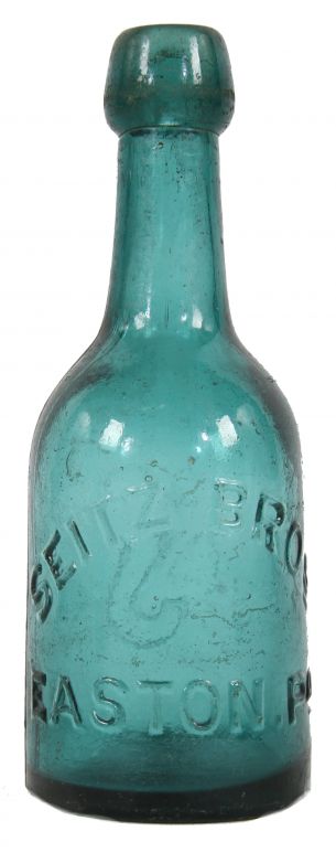 mid-nineteenth century (1853-1865) medium blue green porter shaped bottle finished with an intact blob top and manufactured by philadelphia area glassworks.