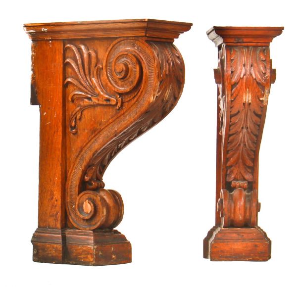 two matching opposed late 19th century remarkable hand carved solid oak wood pier mirror or console undershelf supports with intricate leafage 
