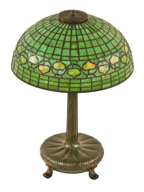 signed tiffany studios original and intact favrile art glass electric table or desk lamp with a strongly geometric and brilliantly colored shade featuring a band of acorns 