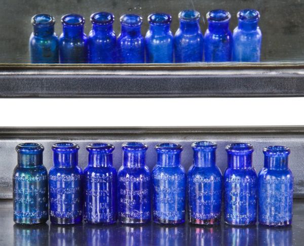 eight original early 1890's mouth-blown diminutive privy dug cobalt blue glass cork stoppered bromo-seltzer medicinal bottles with rolled or "bead finish" lips