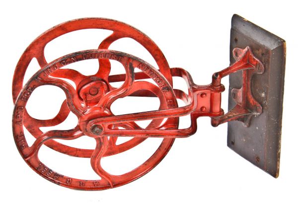 beautiful and rare 1890's fully functional american industrial swing-out ornamented cast iron fire hose reel bracket with original red paint finish largely intact 