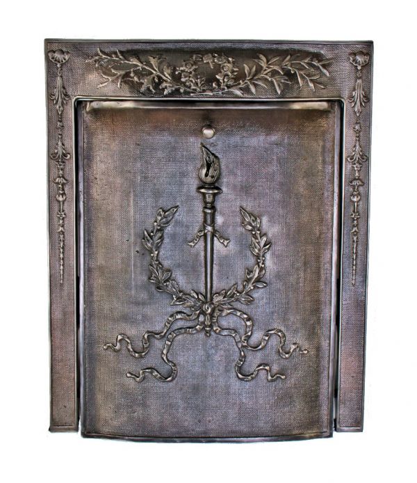 completely intact refinished late 19th century original interior residential fireplace ornamental cast iron surround with matching summer cover featuring a laurel wreath