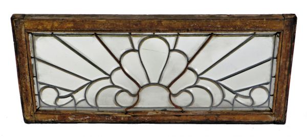 original and intact late 1880's oversized chicago residential all-beveled leaded glass transom window featuring a centrally located palmette