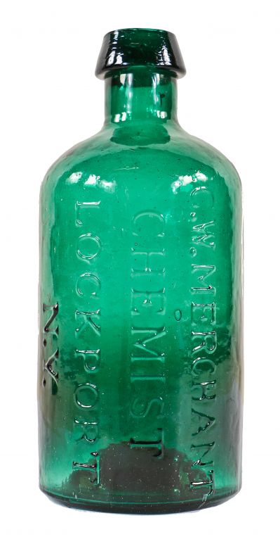 rare mid-nineteenth century vibrantly colored emerald green glass privy dug iron pontiled chemist bottle manufactured for george w. merchant in lockport, n.y. 