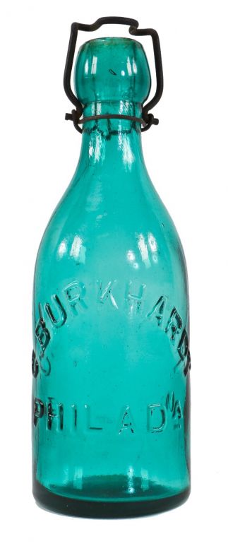 original and intact vibrantly colored antique american deep blue-green low-shouldered smooth base  c. burkhardt soda bottle with applied blobtop