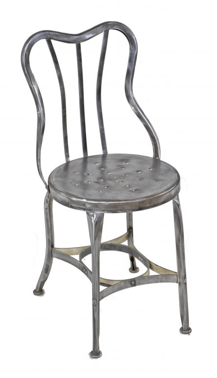 early 20th century american industrial pressed and folded riveted joint all-metal "perfection" soda fountain or druggist chair with fanciful curved backrest