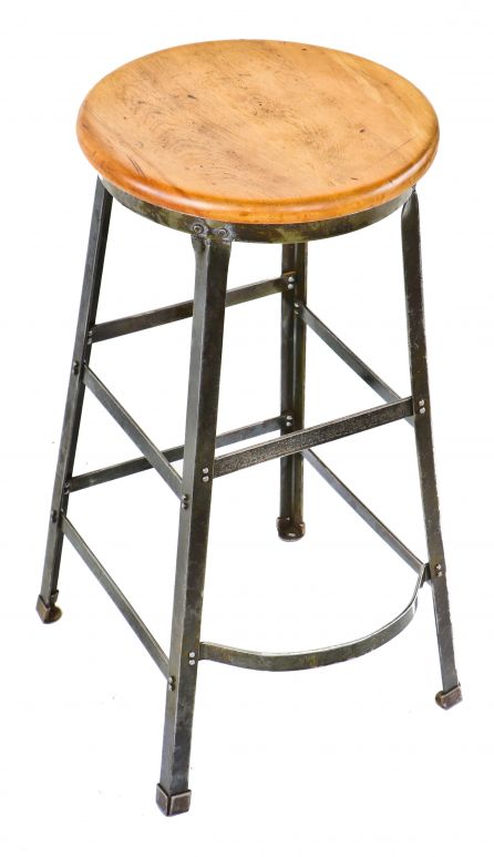late 1930's or early 1940's american industrial four-legged riveted joint refinished angled steel aeronautics part factory machine shop stool with footrest 