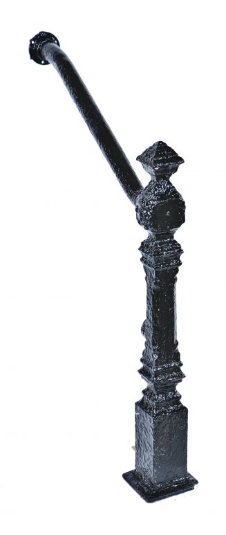 single late 19th century salvaged victorian era ornamental cast iron exterior residential newel post with bent tubular steel hand railing and flange