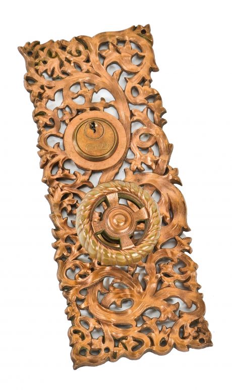 hard to find and highly sought after late 19th century original ornamental cast bronze "kelp" pattern entrance door backplate and matching spoked doorknob 