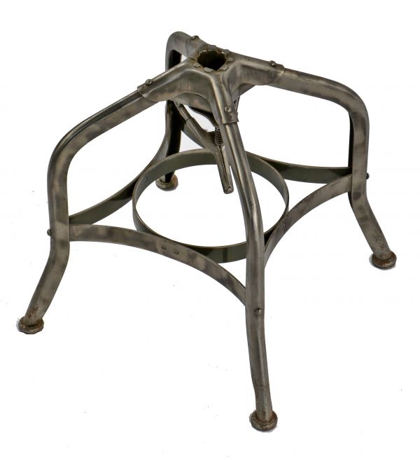 refinished partially intact american c. 1930's industrial "uhl art steel" pressed and folded riveted joint four-legged stool base with intact steel leveler foot pads