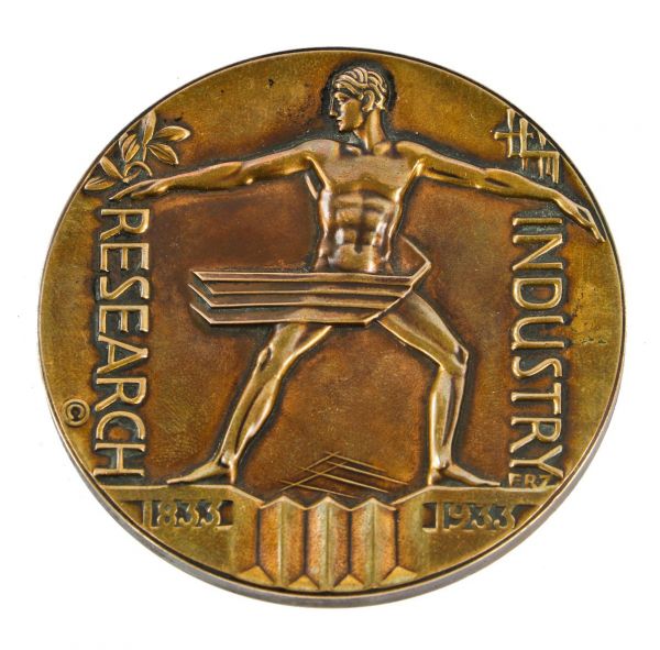 all original and nicely aged cast bronze american art deco commemorative medallion paperweight designed by robert zettler for the 1933 "century of progress" chicago exposition.