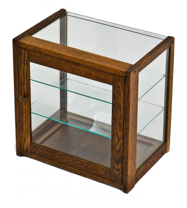 early 20th century diminutive original and intact varnished oak wood store clean and compact countertop display cabinet with sidelights and two glass shelves