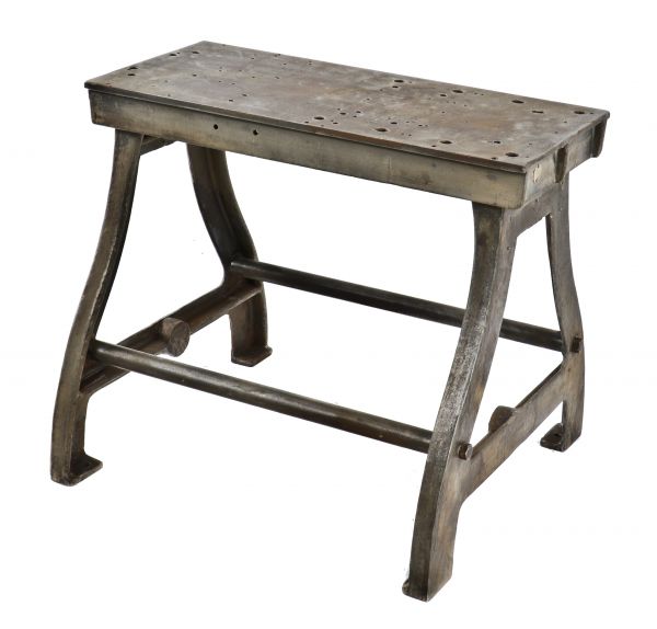 c. 1920's original and robust oversized heavy cast iron american industrial typesetting machine table base with a solid steel deck and tubular stretchers 