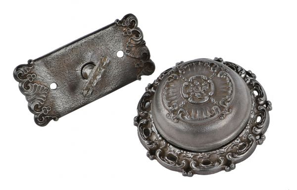 original early 20th century antique american late victorian era ornamental cast iron flush mount exterior residential doorbell with matching thumb turn with escutcheon 