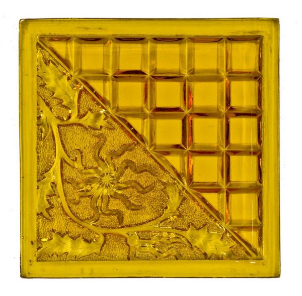 all original and intact late 19th or early 20th century american streetcar transom window amber-colored pressed ornamental glass panel with cube and diagonal flower pattern