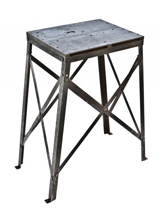 original and remarkably intact single refinished antique american industrial brushed angled steel four-legged stationary machine shop table or work stand with extensive cross-bracing