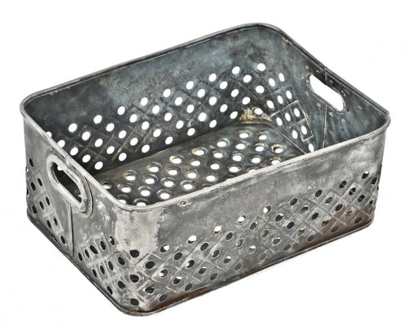 unusual early 1920's all original riveted joint american industrial perforated steel rolled rim basket or tote with oval-shaped opposed carrying handles