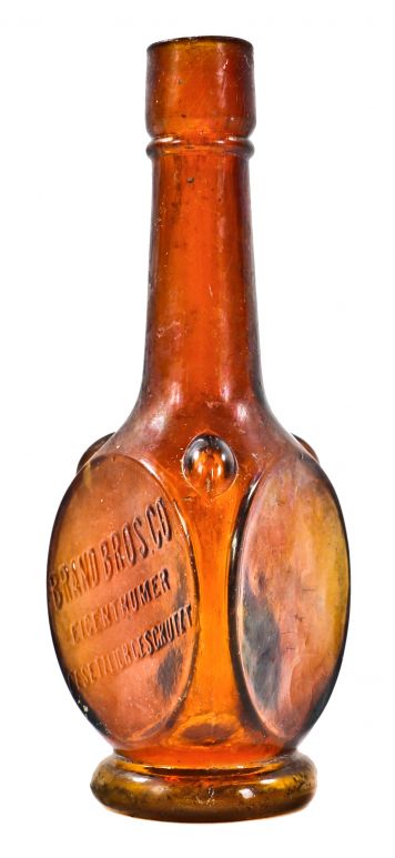 rare intact and all original late nineteenth sample size golden amber bitters bottle manufactured for chicago liquor merchants the brand brothers company.