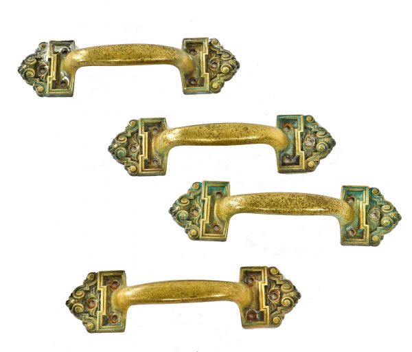 set of four matching oversized early 20th century ornamental cast brass interior blackstone hotel window sash pull handles with nicely aged surface patina