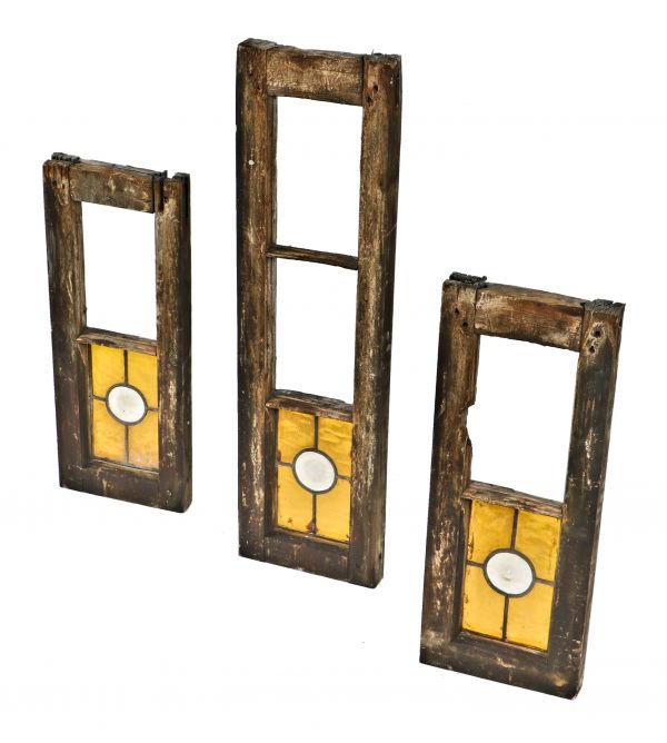 set of three worn and weathered partially intact late 19th century adams street church original art glass windows with amber cathedral roll glass surrounding oversized opalescent rondels