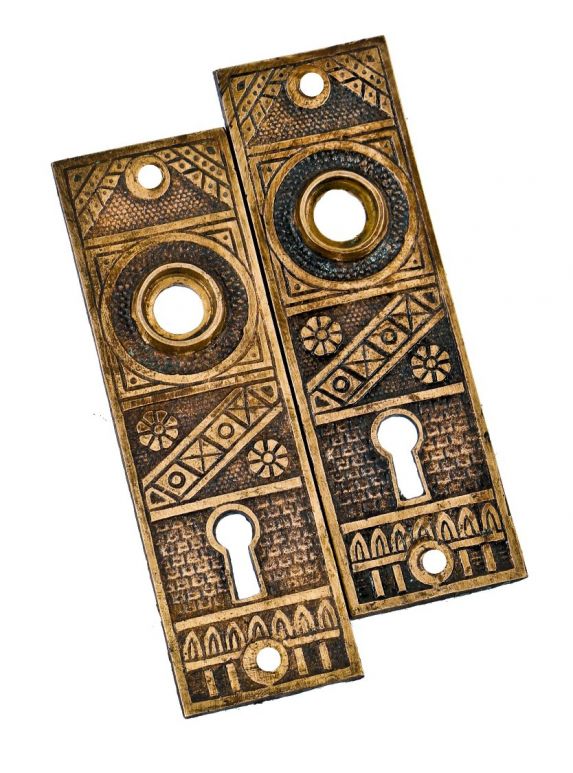 matching set of original ornamental cast brass salvaged chicago church building "geometric" pattern doorknob backplates or escutcheons with single keyholes 