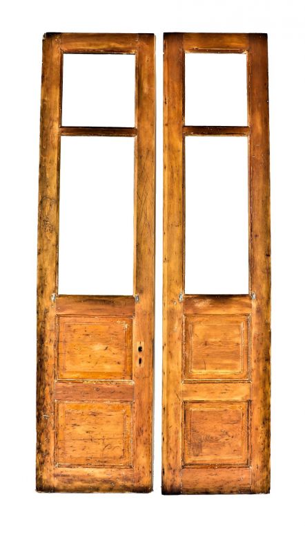 pair or set of original c. 1880's antique american yellow pine wood tall and narrow interior vestibule church doors with raised panels and spacious openings for glass panes