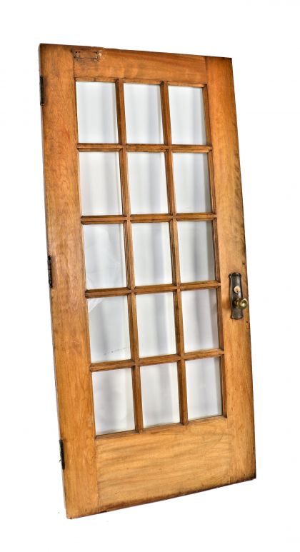 single all original and intact interior residential salvaged chicago double panel varnished birch wood apartment building door with pressed glass doorknobs