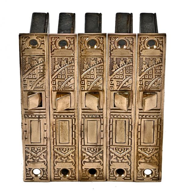group of five original highly desirable ornamental cast brass "ceylon" pattern interior residential passage door mortise locks with fully functional latch bolts
