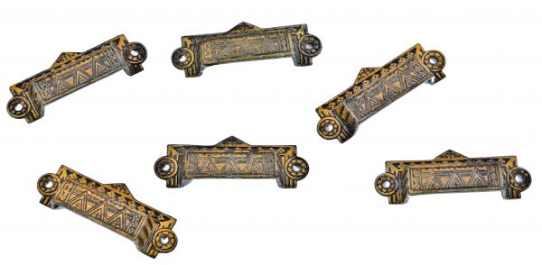 all original and well-maintained copper-plated cast iron "crisscross" pattern eastlake style drawer handles with intact baked black enameled finish