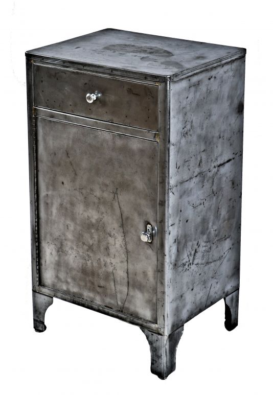robust all original american depression era heavy gauge medical cabinet with single pull-out drawer and hinged cabinet door with original hardware and brushed metal finish