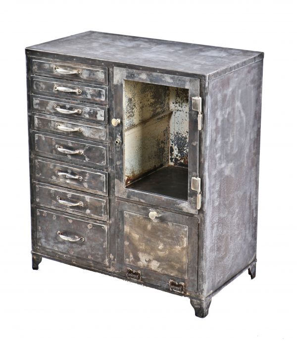 robust early 20th century antique american medical cold-rolled steel hospital operating room instrument and/or supply cabinet with glass-paneled cabinet door 