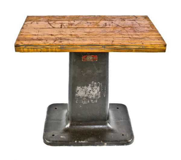 original antique american industrial heavy duty repurposed cast iron factory machine shop base with a newly added weathered and worn maple wood butcher block top