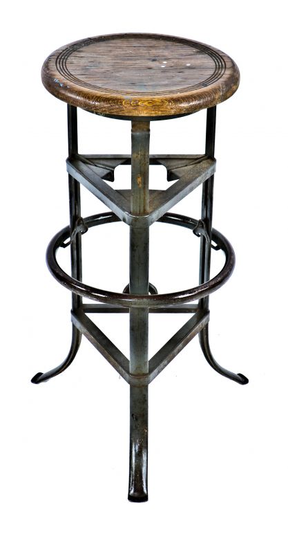 highly sought after fully functional antique american industrial "rite-hite" three-legged adjustable height factory machine shop stool with flared feet