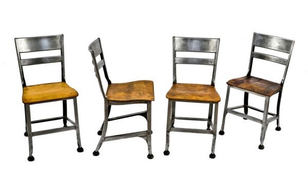 group of four matching thoroughly cleaned and refinished depression era "uhl art steel" pressed and folded metal stationary chairs with original rubber "feet"