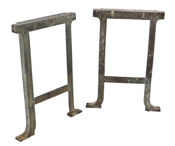 two of six matching original early 20th century antique american industrial robust cast iron factory machine shop legs or bases with brushed metal finish