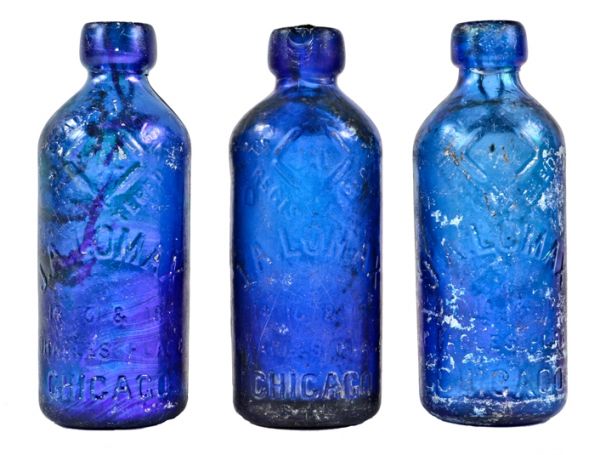 group of three original richly colored c. 1880's unearthed chicago john lomax cobalt blue soda or mineral water bottles with patented spring stoppers 
