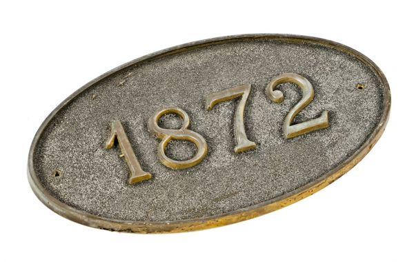 custom-made original elongated oval-shaped single-sided chicago workers cottage date plaque comprised of cast bronze with raised numbers