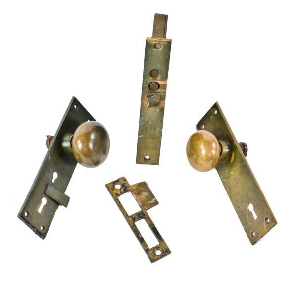 original and fully functional c. 1880's unornamented cast bronze salvaged chicago entrance door lockset with screwless spindles and swinging keyhole cover