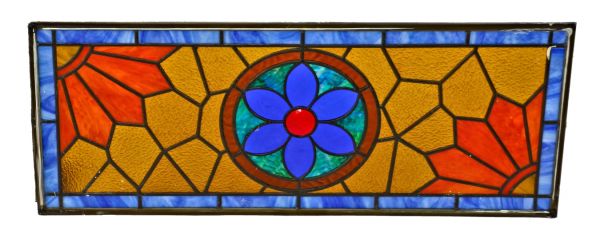 brightly colored fully restored late 19th century salvaged chicago stained glass residential transom window with centrally located floral rosette
