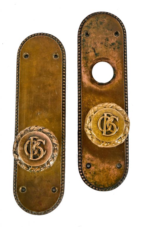 original 1890's complete old colony building interior office door matching monogrammed doorknob lockset comprised of brass with nicely aged surface patina 