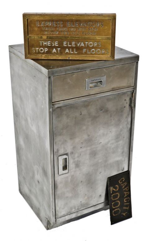 one of two matching brushed metal "lefebure" pressed and folded steel chicago bank building cabinets with single pull-out drawer and oversized door