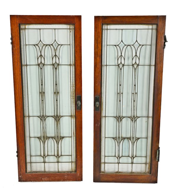 matching set of original c. 1920's salvaged chicago leaded glass interior oak wood cabinet doors with floral motifs within a rectilinear grid