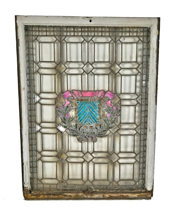 unusual c. 1910-195 salvaged chicago oversized leaded art glass residential window featuring a centrally located variegated shield and laurel wreath