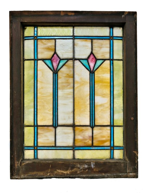 original and intact c. 1920's salvaged chicago variegated art glass bungalow window with two matching centrally located abstract floral motifs enclosed in the original wood sash frame 