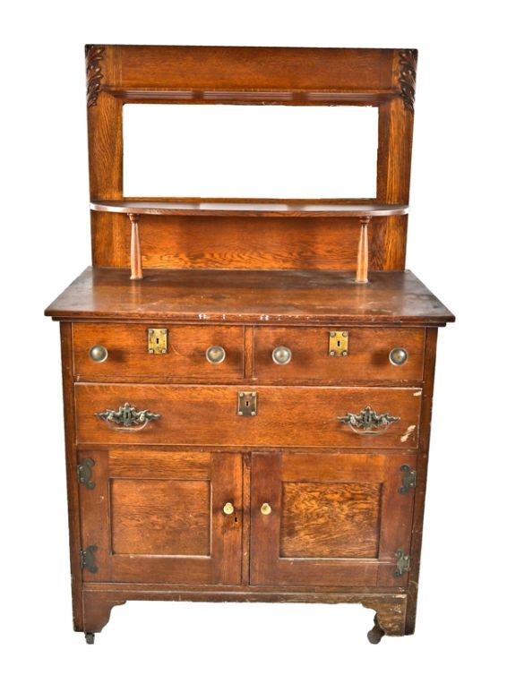 original early 20th century craftsman style varnished oak wood dresser or bureau with intact rectangular-shaped mirror and cabinet drawers and doors